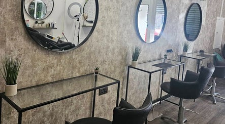 Elegant salon interior at Pamela Connor, Dundee, Scotland, GB, featuring stylish seating and modern decor.