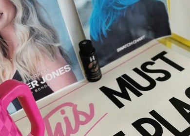 Pamela Connor's beauty display with vibrant posters in Dundee, Scotland, GB.