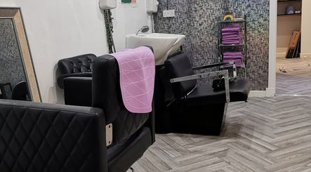 Elegant salon seating and basin at This Is It in Dundee, Scotland, GB, highlighting sleek design and comfort.
