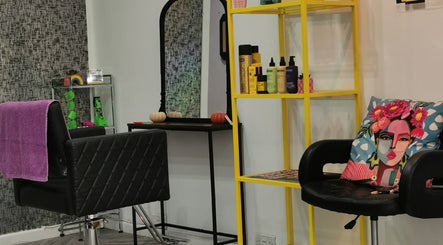 Chic salon corner at This Is It, Dundee, Scotland, GB, featuring modern hair products and vibrant decor.