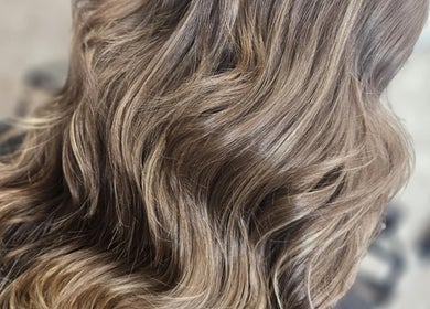 Elegant wavy hair styled at This Is It salon in Dundee, Scotland, GB.