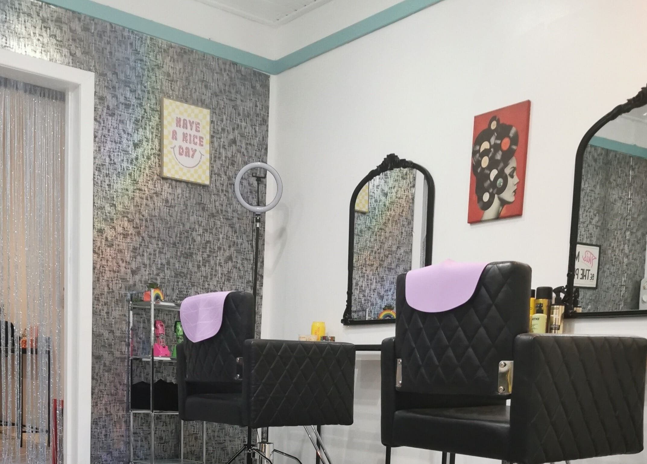 Elegant salon chairs and mirrors at This Is It, Dundee, Scotland, GB.