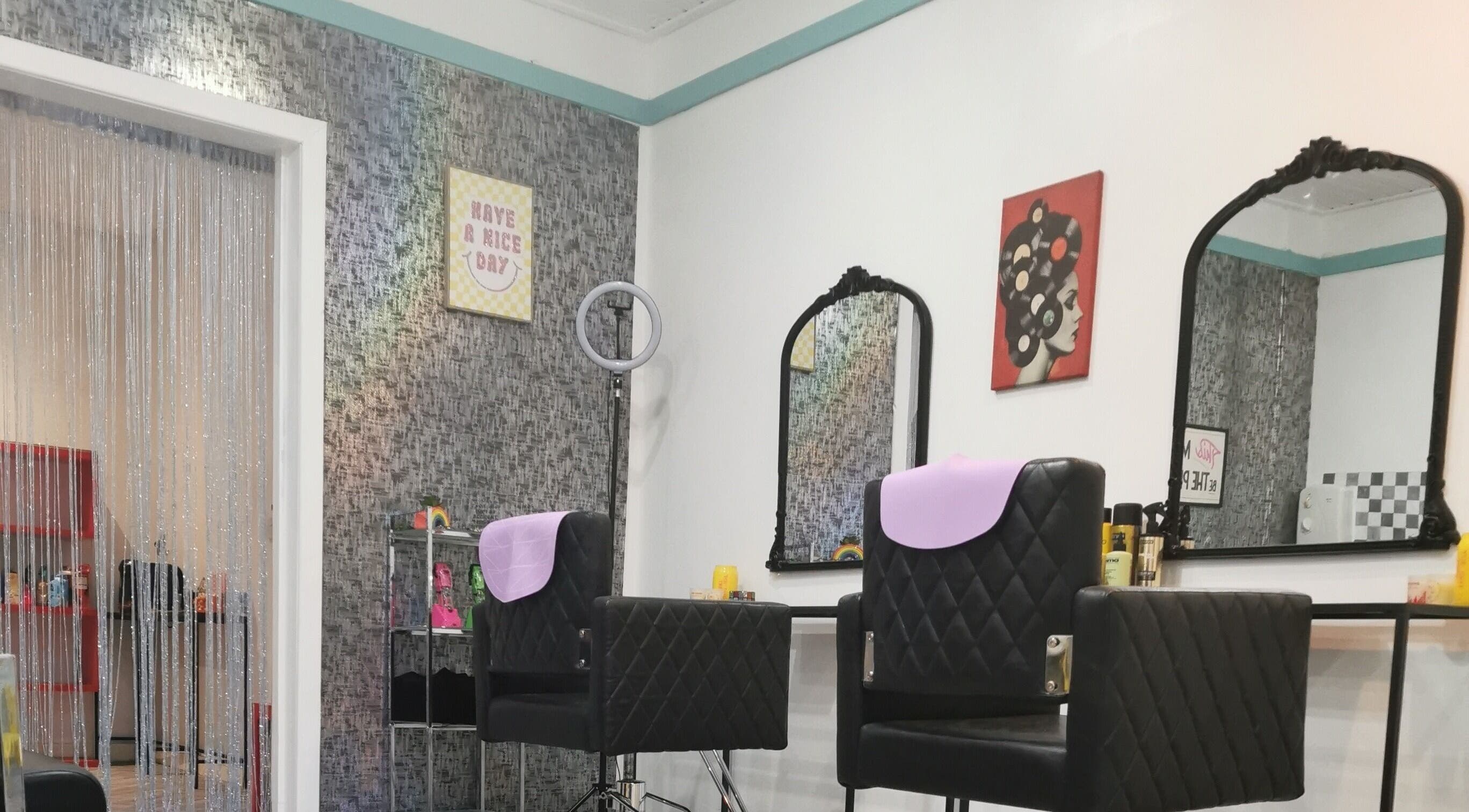 Elegant salon chairs and mirrors at This Is It, Dundee, Scotland, GB.