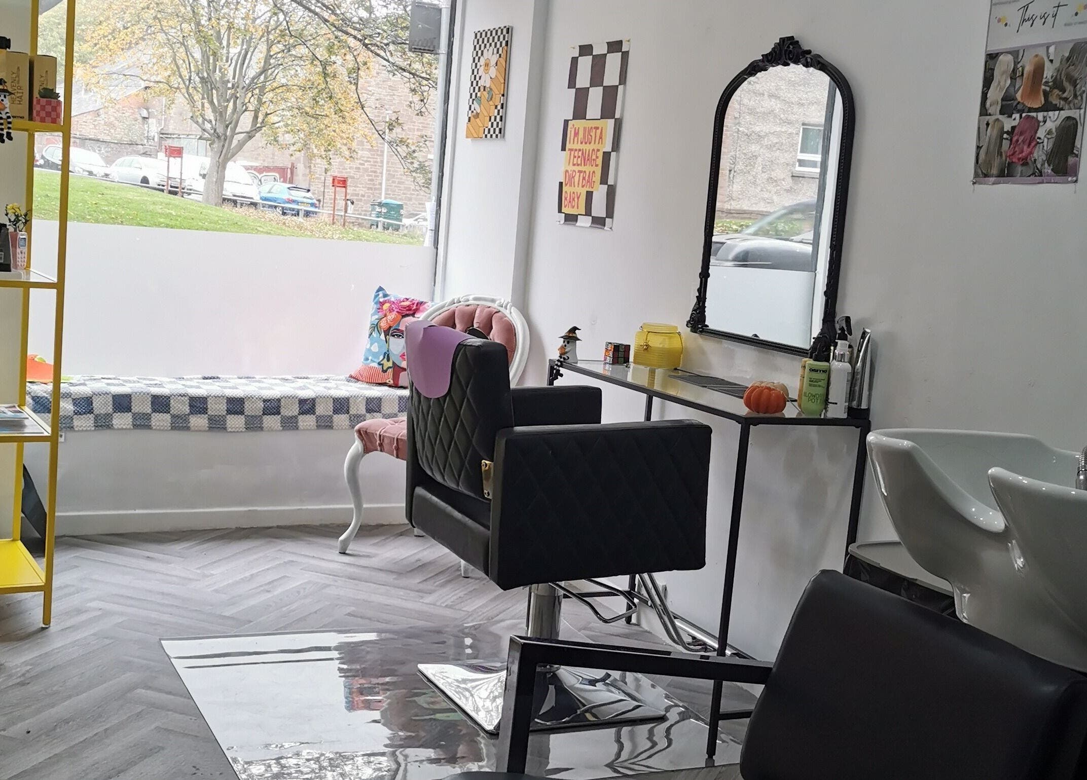 Stylish salon at This Is It, Dundee, Scotland, GB with modern chairs, mirrors, and bright decor.