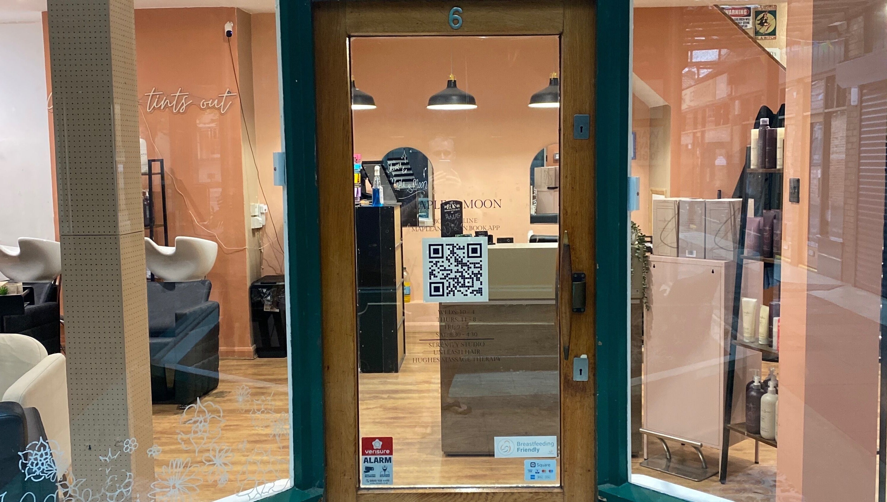 Front view of Hughes Massage Therapy entrance with cozy salon interior in Sleaford, England, GB.