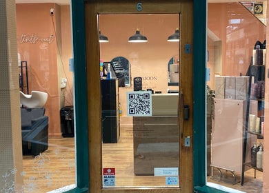 Front view of Hughes Massage Therapy entrance with cozy salon interior in Sleaford, England, GB.