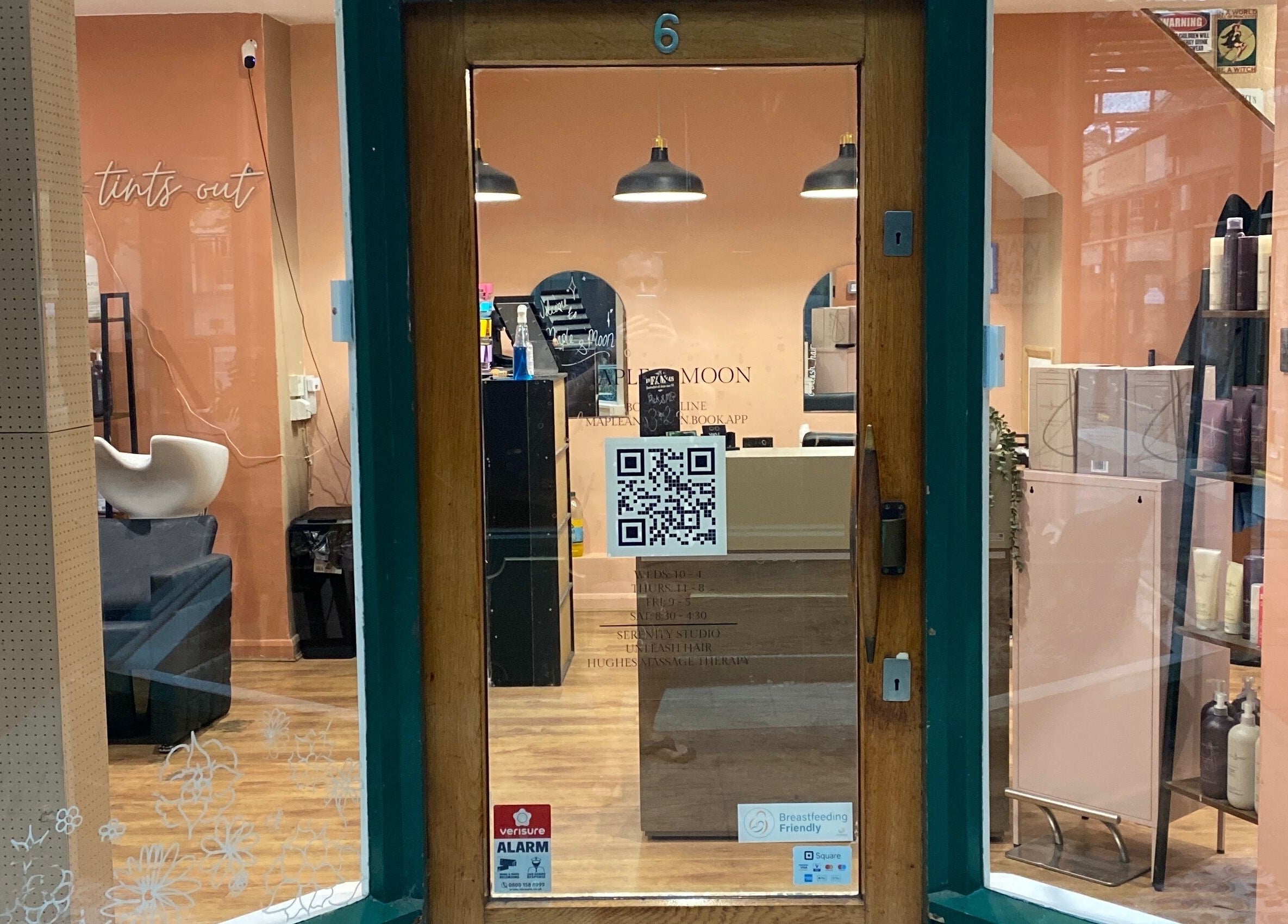 Front view of Hughes Massage Therapy entrance with cozy salon interior in Sleaford, England, GB.