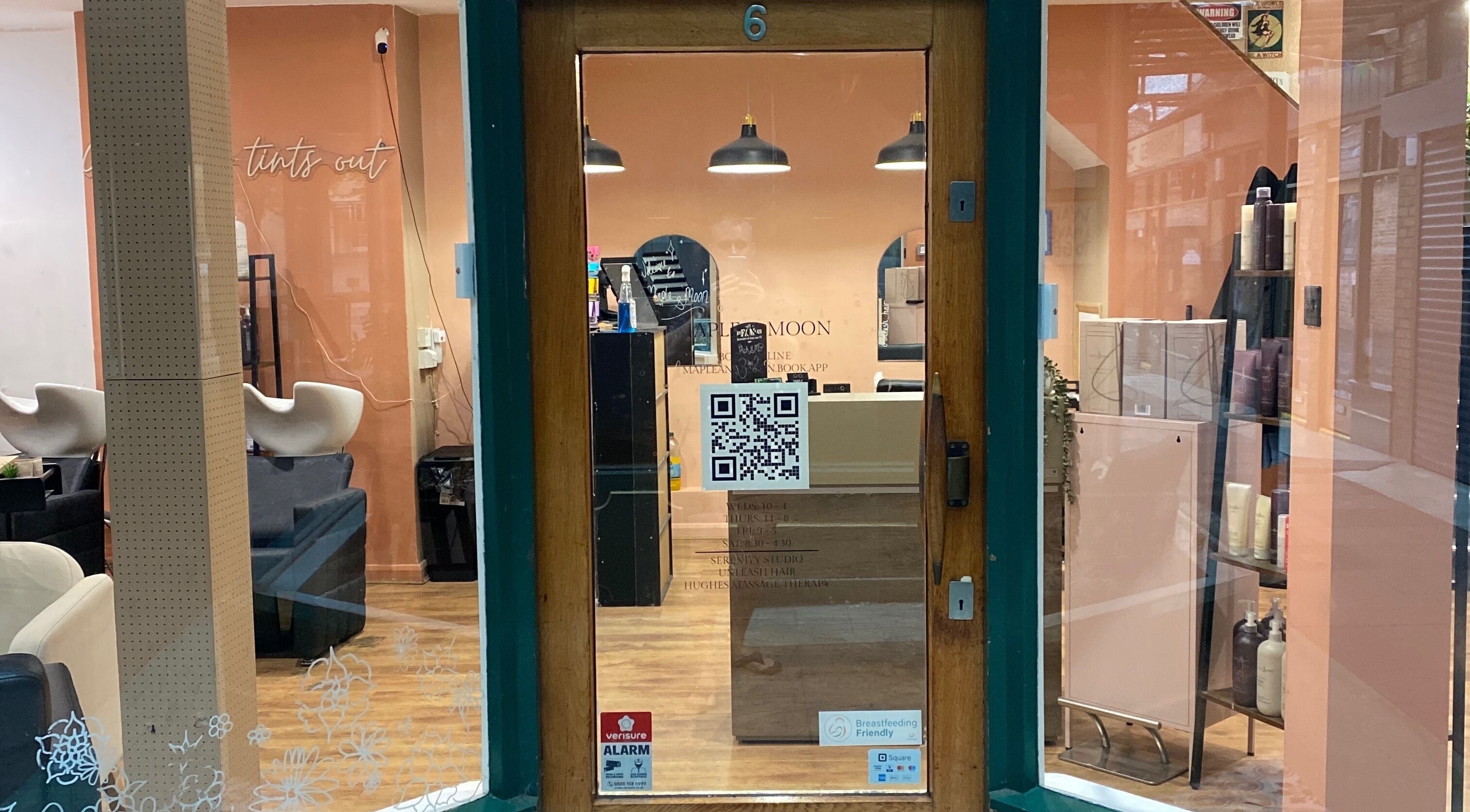 Front view of Hughes Massage Therapy entrance with cozy salon interior in Sleaford, England, GB.