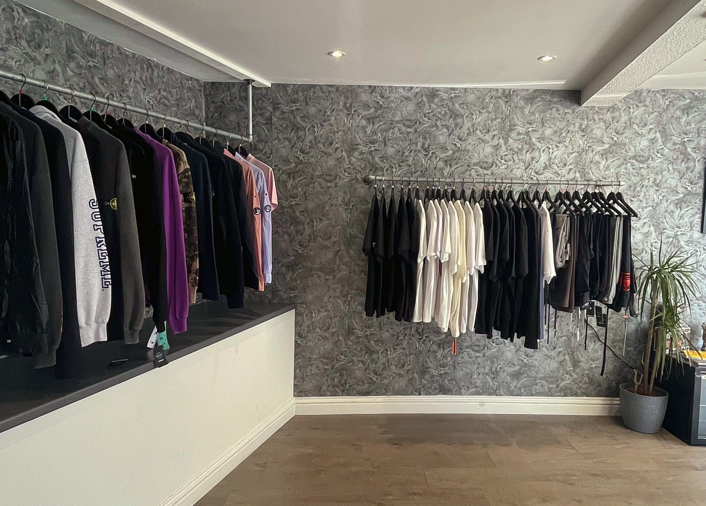 Stylish clothing display at Element 85 Barbers, Leven, Scotland, GB with modern decor.