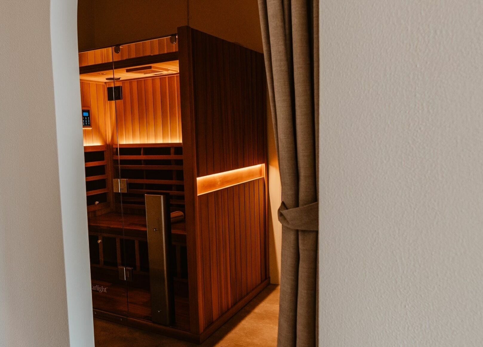 Experience relaxation at Aura Sweat's infrared sauna in Thirroul, New South Wales, AU. Warm wood tones invite tranquility.
