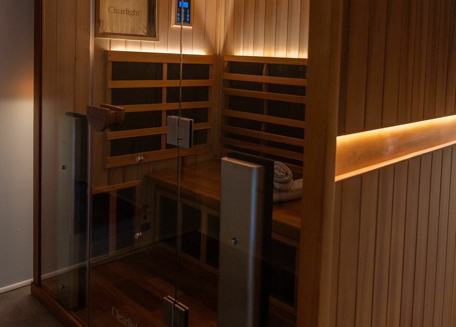 Cozy infrared sauna at Aura Sweat, Thirroul, New South Wales, AU, showcasing a serene and inviting wooden interior.