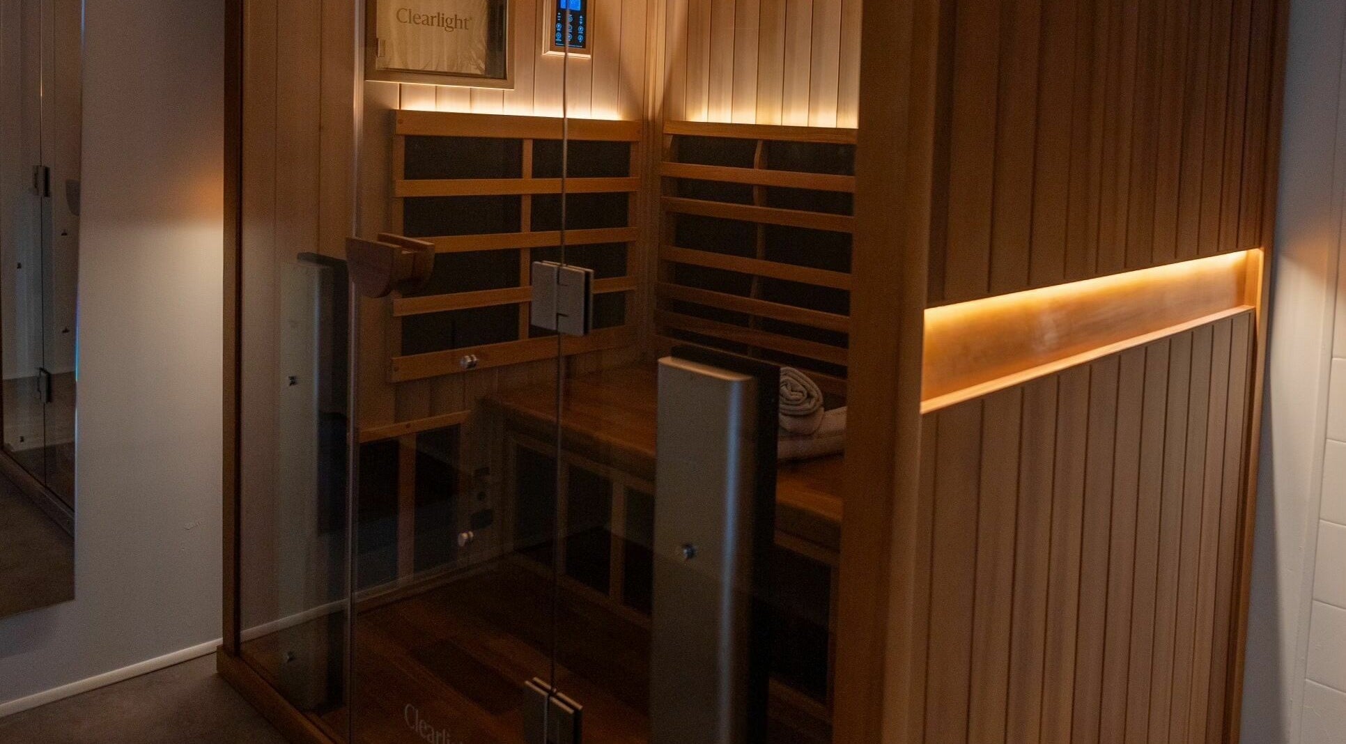 Cozy infrared sauna at Aura Sweat, Thirroul, New South Wales, AU, showcasing a serene and inviting wooden interior.