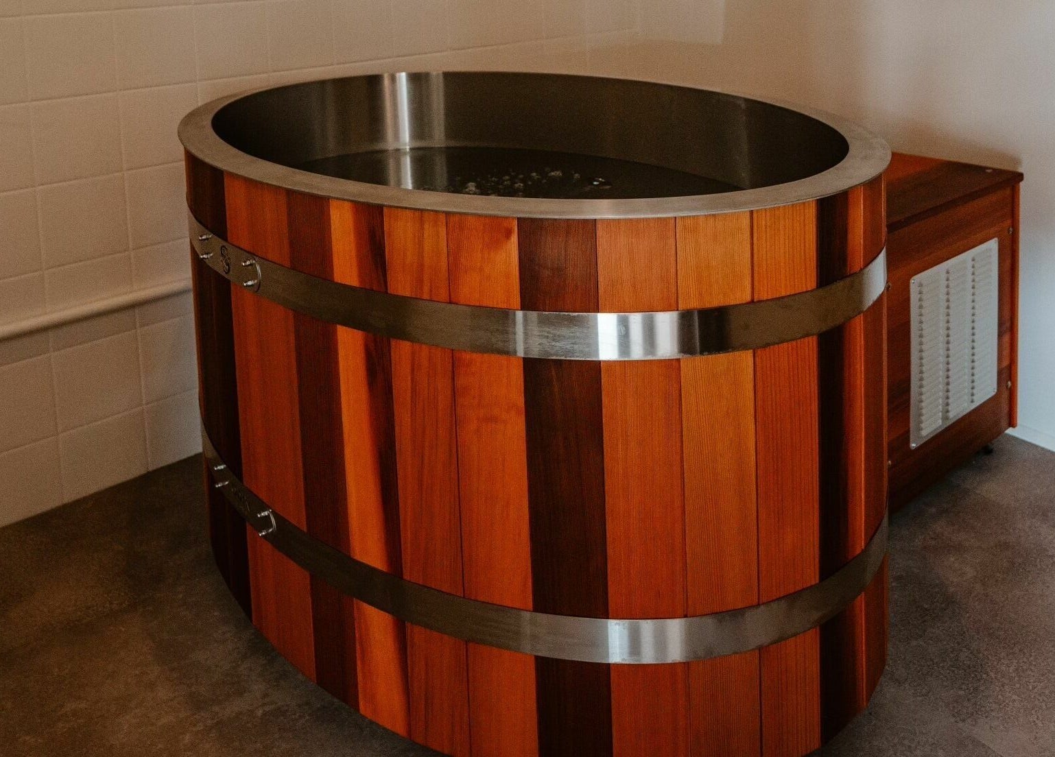 Luxurious wooden tub at Aura Sweat, Thirroul, New South Wales, AU, perfect for a relaxing spa experience.