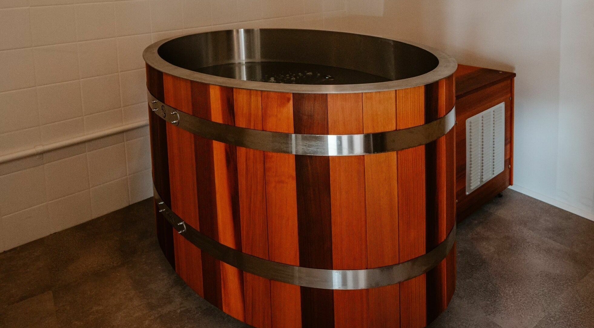 Luxurious wooden tub at Aura Sweat, Thirroul, New South Wales, AU, perfect for a relaxing spa experience.