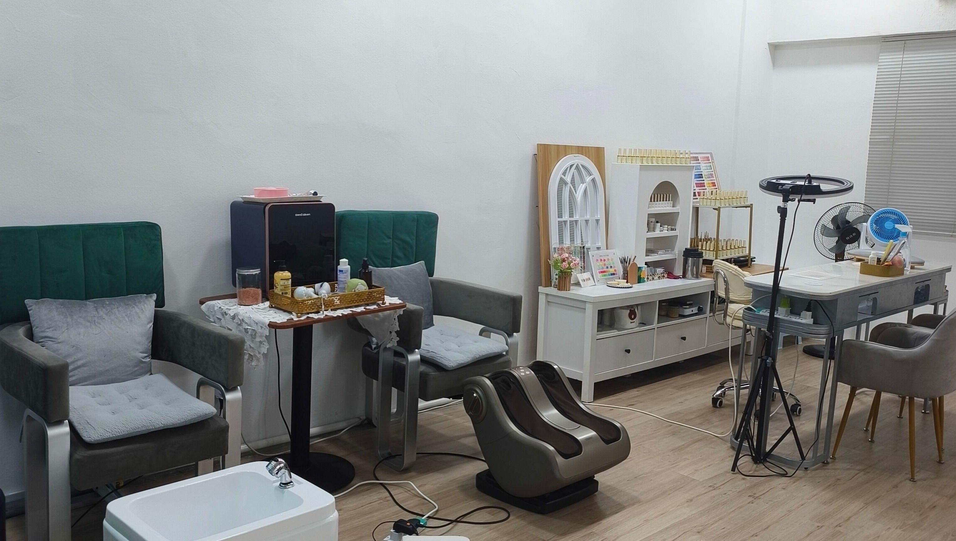 Cozy interior of Rainbow Nail Spa, Subang Jaya, Selangor, MY, showcasing modern chairs and nail care equipment.