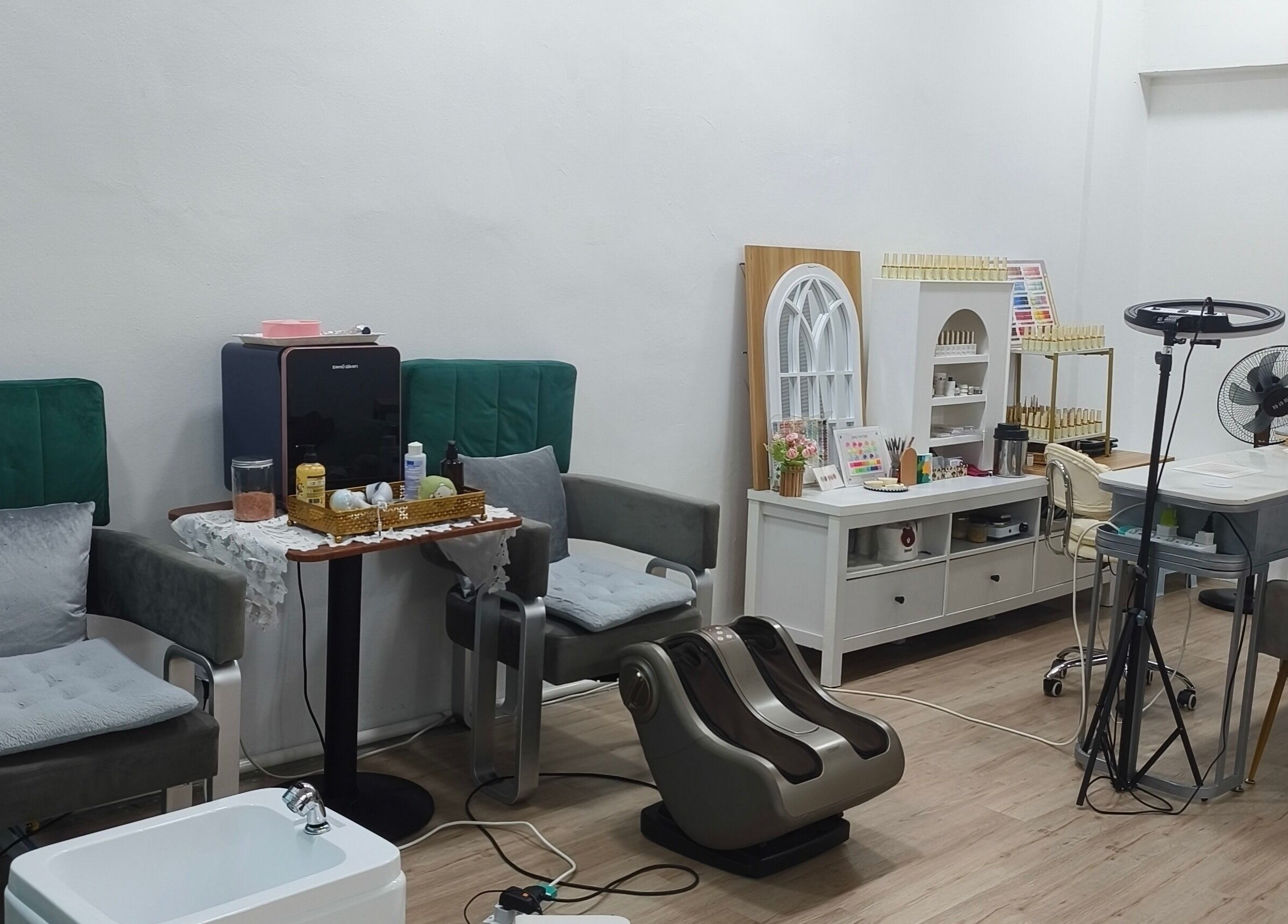 Cozy interior of Rainbow Nail Spa, Subang Jaya, Selangor, MY, showcasing modern chairs and nail care equipment.