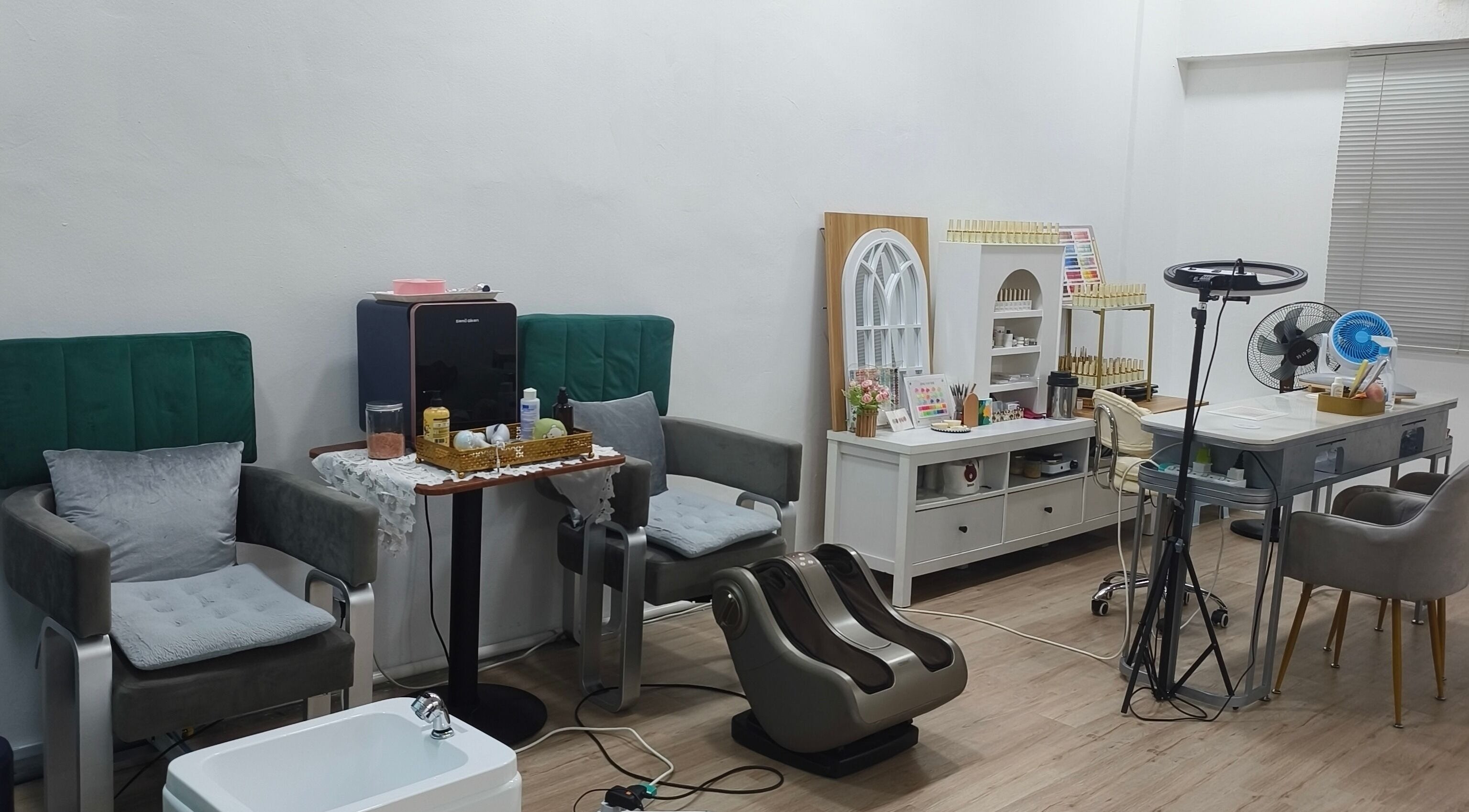 Cozy interior of Rainbow Nail Spa, Subang Jaya, Selangor, MY, showcasing modern chairs and nail care equipment.