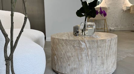 Elegant seating area with chic decor at Edge Brows in Sydney, New South Wales, AU.