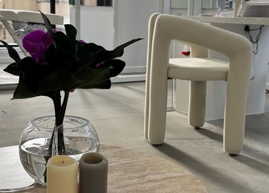 Minimalist interior at Edge Brows, Sydney, New South Wales, AU, featuring elegant vase and candles.