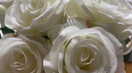 Elegant white roses in full bloom at Becky, Frimley Green, England, GB enhancing the beauty ambiance.