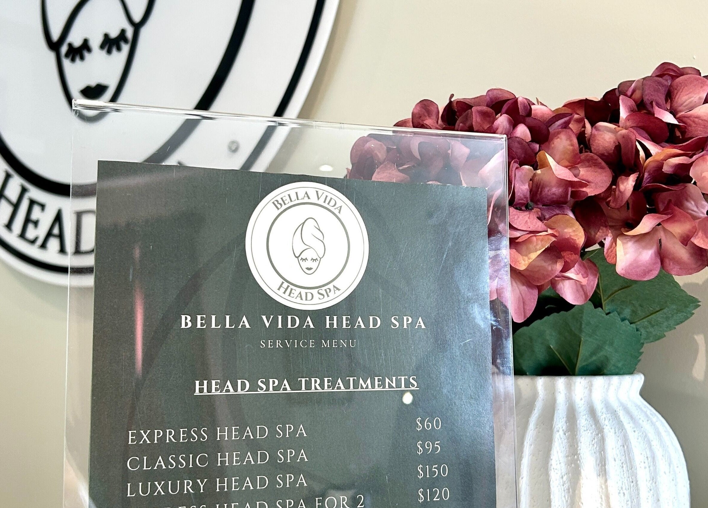 Menu of Bella Vida Head Spa with hydrangeas, located in Bowmanville, Ontario, CA.