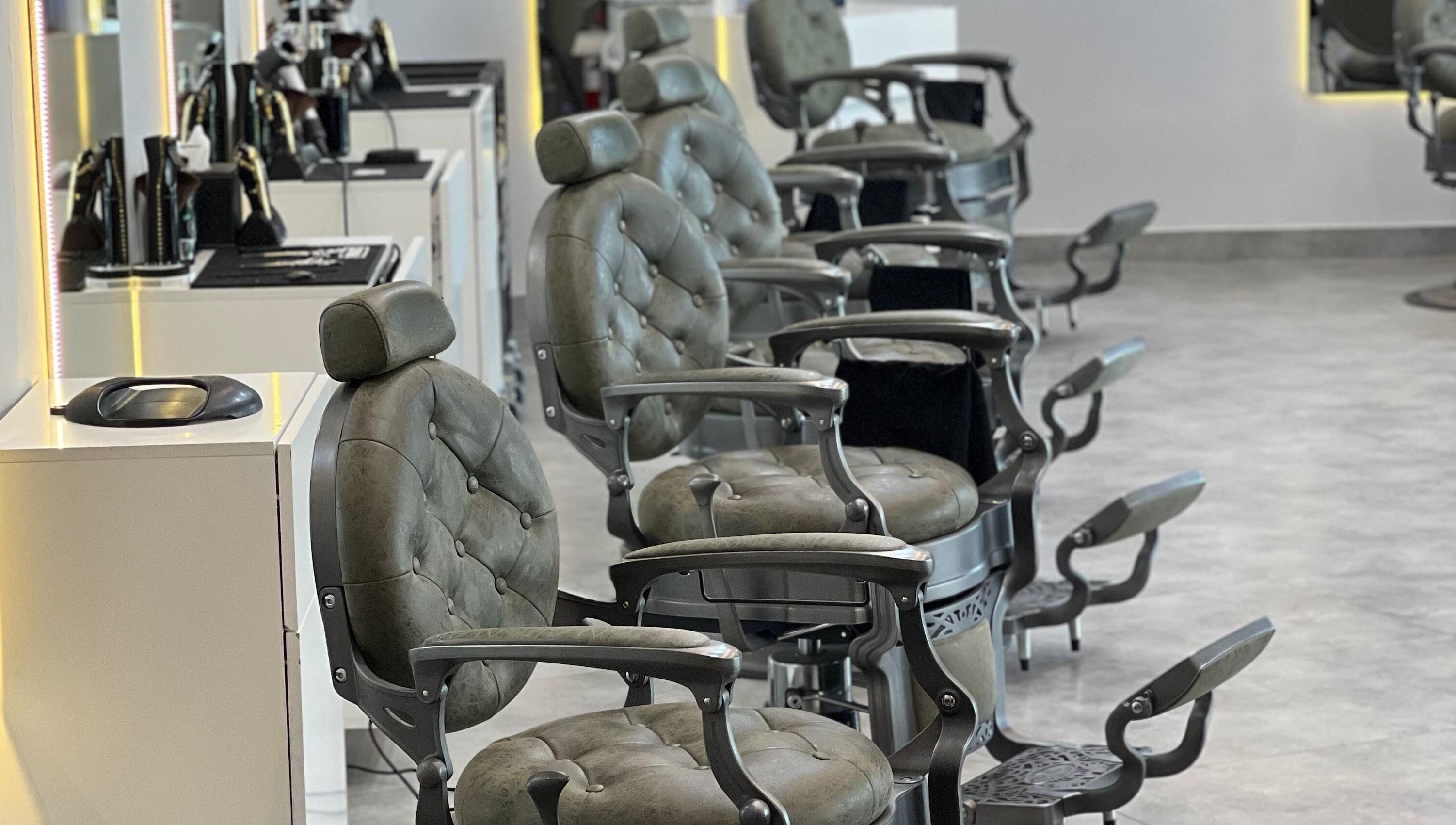 Luxurious barber chairs at Barber Bliss L.L.C, Dubai, Dubai, AE, offering premium grooming services.