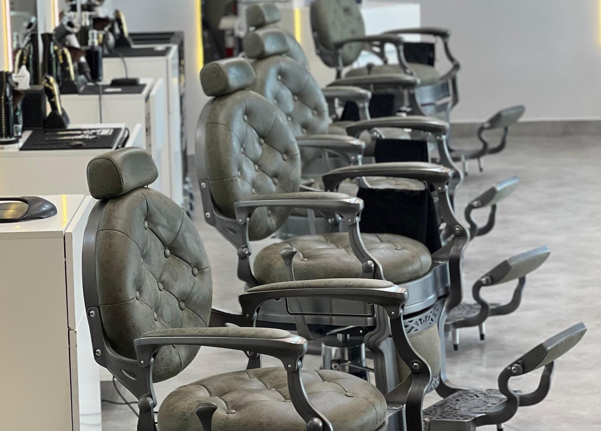Luxurious barber chairs at Barber Bliss L.L.C, Dubai, Dubai, AE, offering premium grooming services.