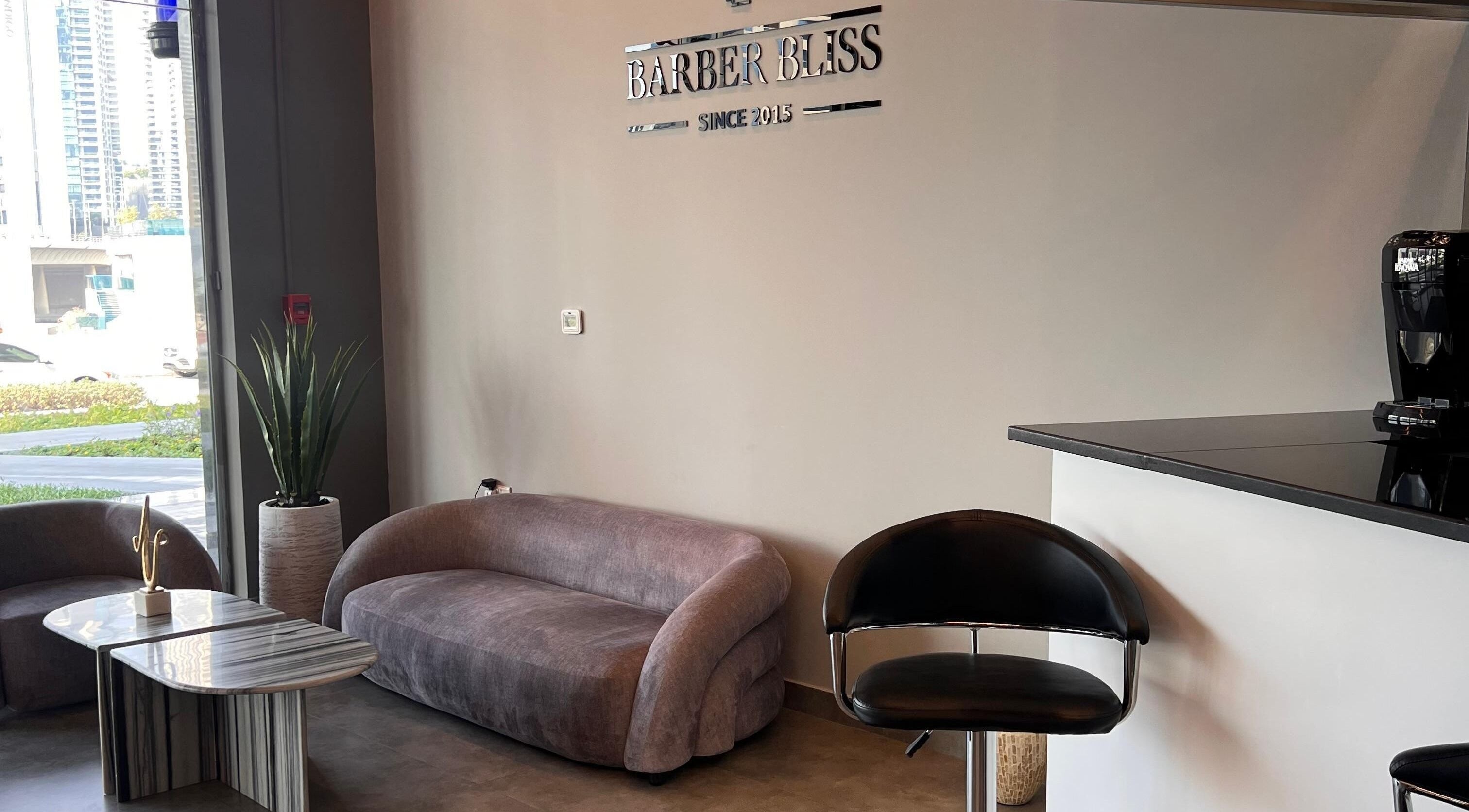 Elegant lounge area at Barber Bliss L.L.C, Dubai, Dubai, AE with sleek furniture and modern decor.