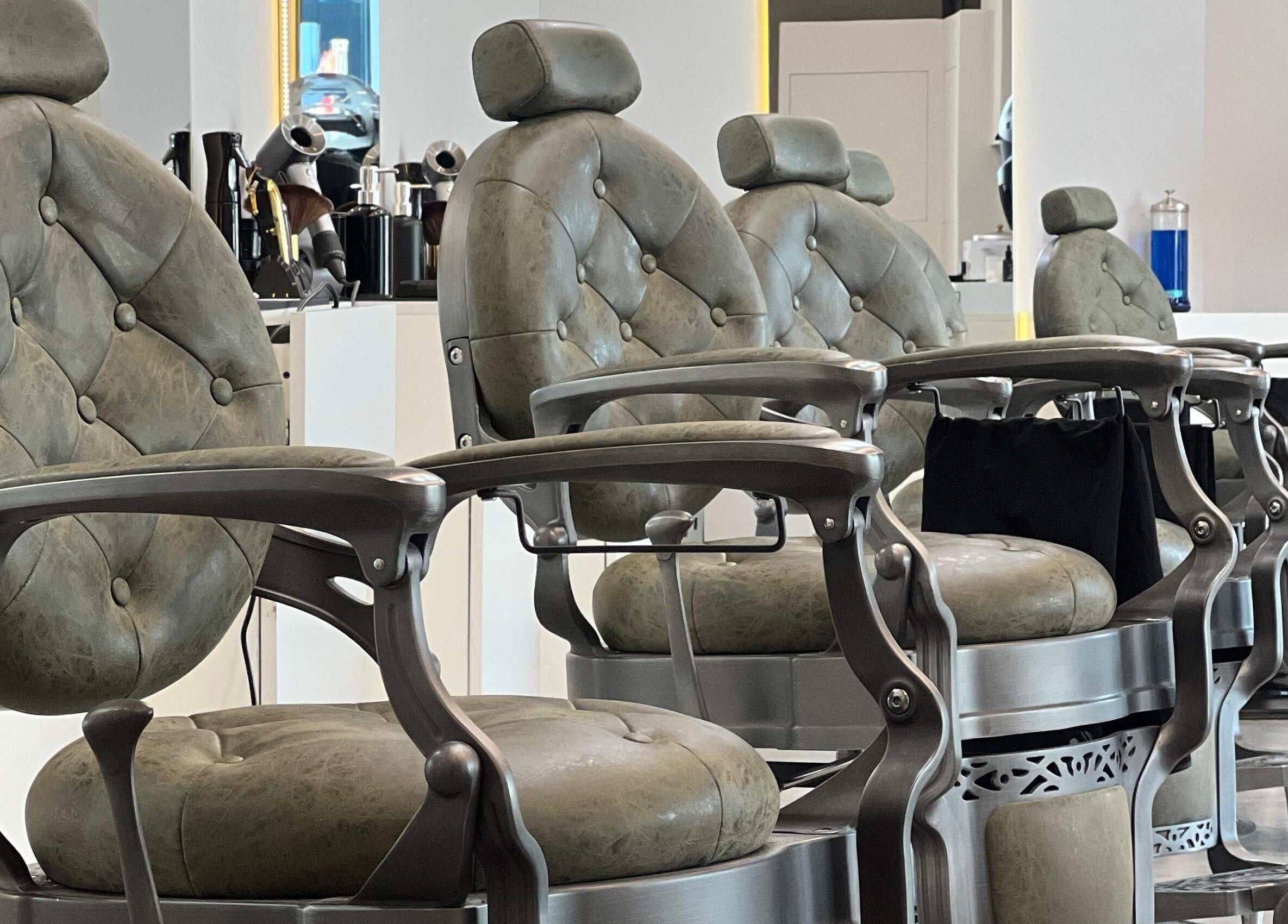Elegant barber chairs at Barber Bliss L.L.C, Dubai, Dubai, AE, offering premium grooming services.