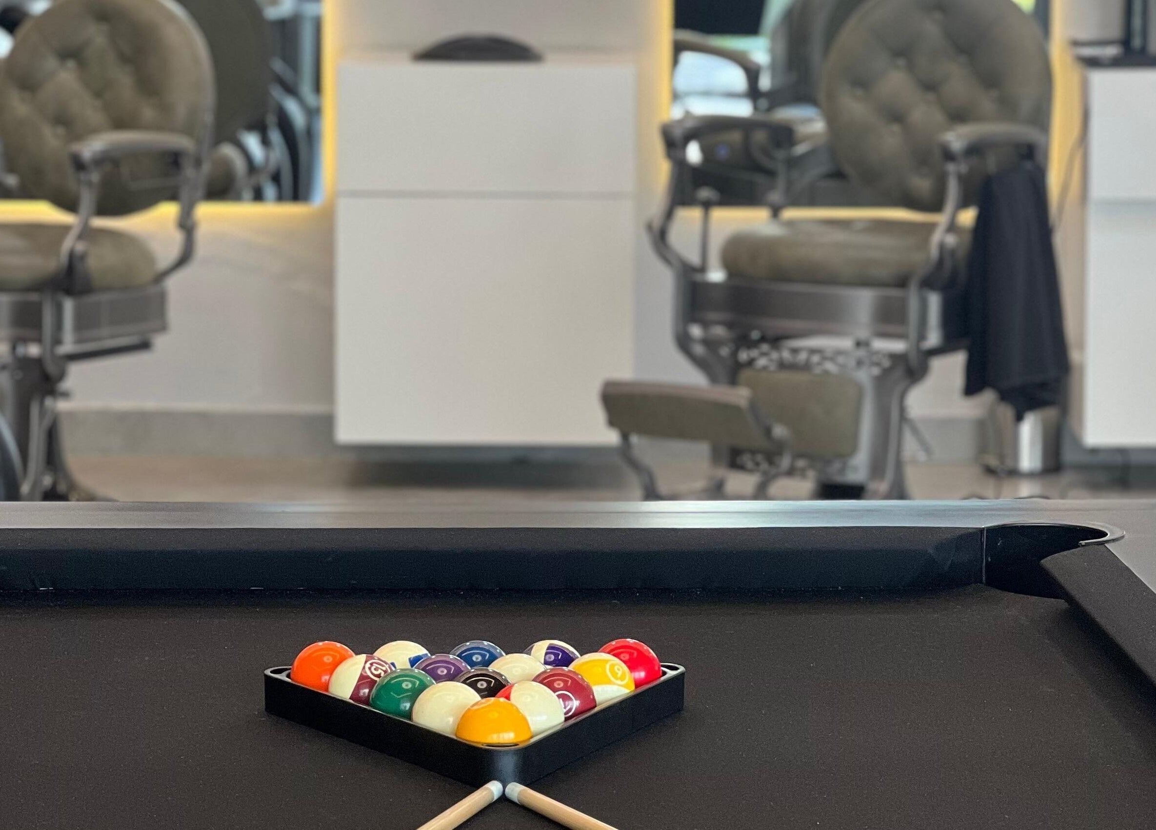 Billiard table at Barber Bliss L.L.C, Dubai, Dubai, AE, creating a relaxed and stylish ambiance.