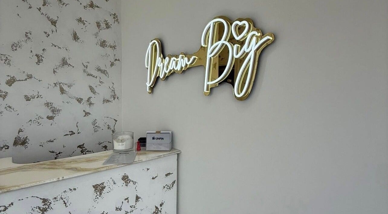 Dream Big neon sign in Hushed Beauty reception, Glasgow, Scotland, GB with chic decor.