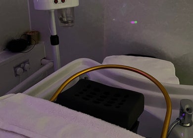 Relaxing spa area at Hushed Beauty, Glasgow, Scotland, GB, featuring modern wellness equipment.