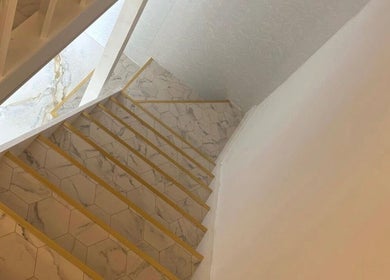 Marble staircase with golden accents at Hushed Beauty in Glasgow, Scotland, GB.