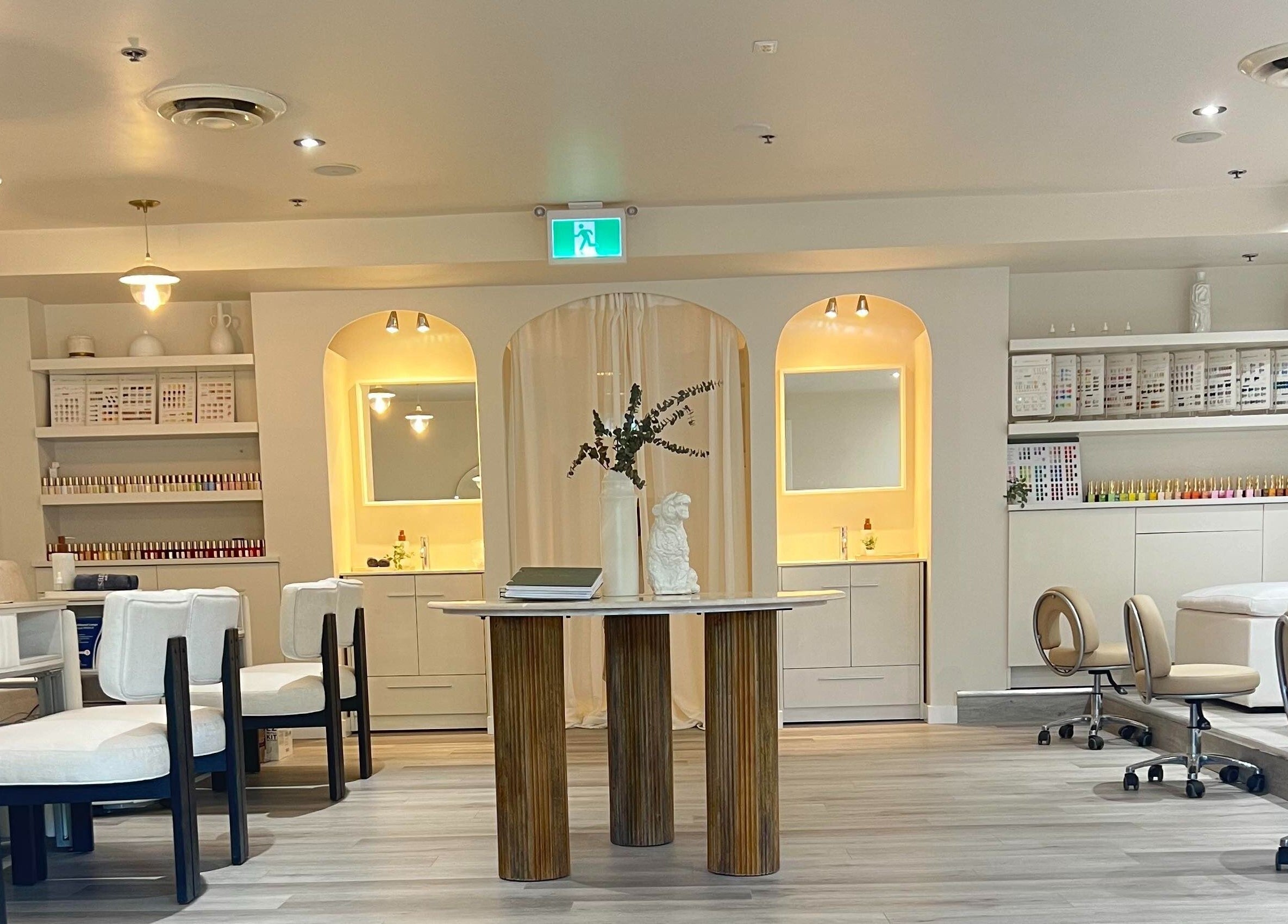 Elegant interior of Artesano Cafe and Nail in Vancouver, British Columbia, CA, featuring stylish seating and decor.