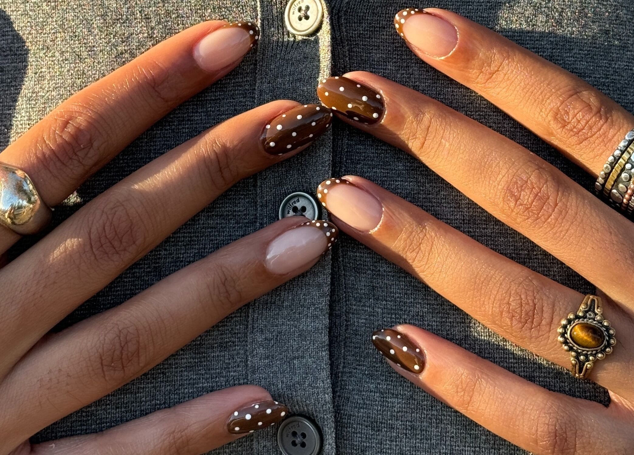 Polished nails with brown polka-dot design at Artesano Cafe and Nail, Vancouver, British Columbia, CA.