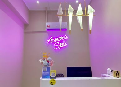Reception area of Aurora Muslimah Salon & Spa Bangsar, Kuala Lumpur, featuring modern decor and soft lighting.