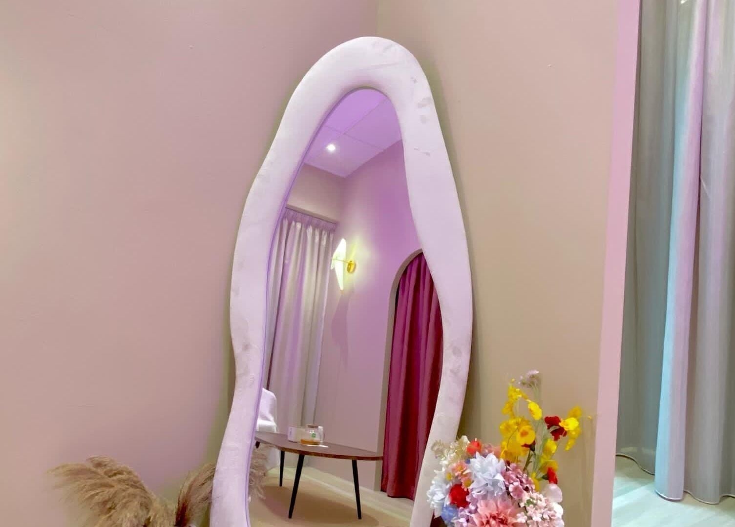 Elegant mirror and floral decor at Aurora Muslimah Salon & Spa Bangsar, Kuala Lumpur, MY.