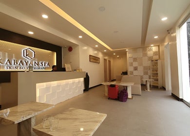 Welcoming lobby of Kabayan Boracay in Malay, Western Visayas, PH with chic modern decor and warm lighting.