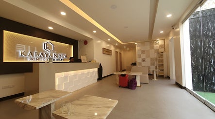 Welcoming lobby of Kabayan Boracay in Malay, Western Visayas, PH with chic modern decor and warm lighting.