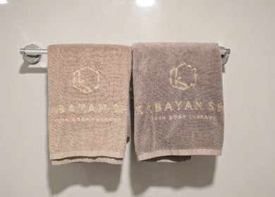 Elegant embroidered towels at Kabayan Boracay spa, Malay, Western Visayas, PH. Luxurious and relaxing ambiance.