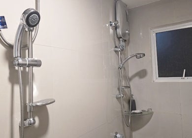 Modern shower setup in Kabayan Boracay's elegant suite, Malay, Western Visayas, PH.