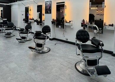 Sleek barber chairs in Razortrim, Birmingham, England, GB, offering a modern grooming experience.