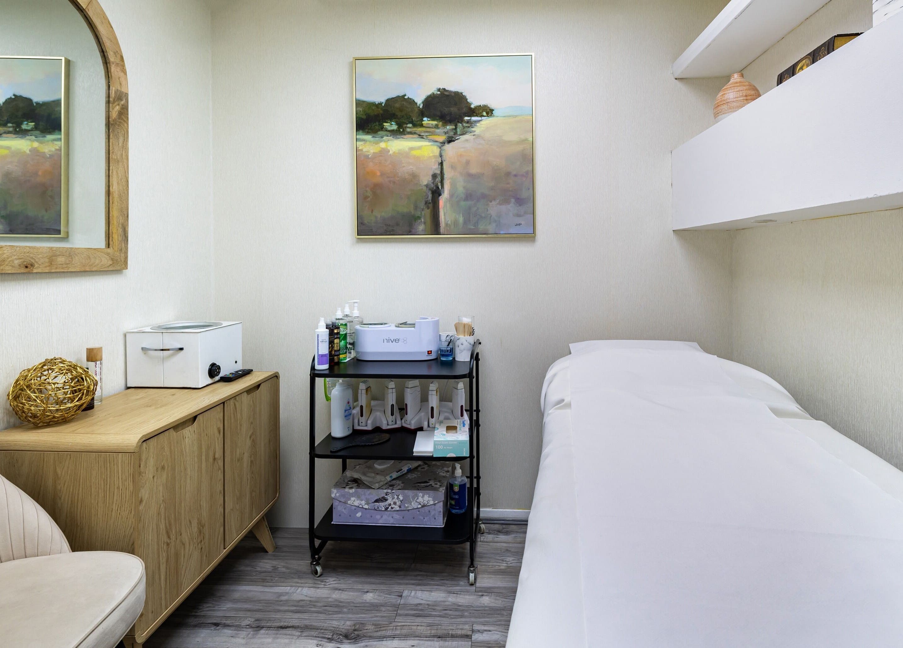 Luxury Wax Bar - Edgware Road offers a serene treatment room in London, England, GB with stylish decor.