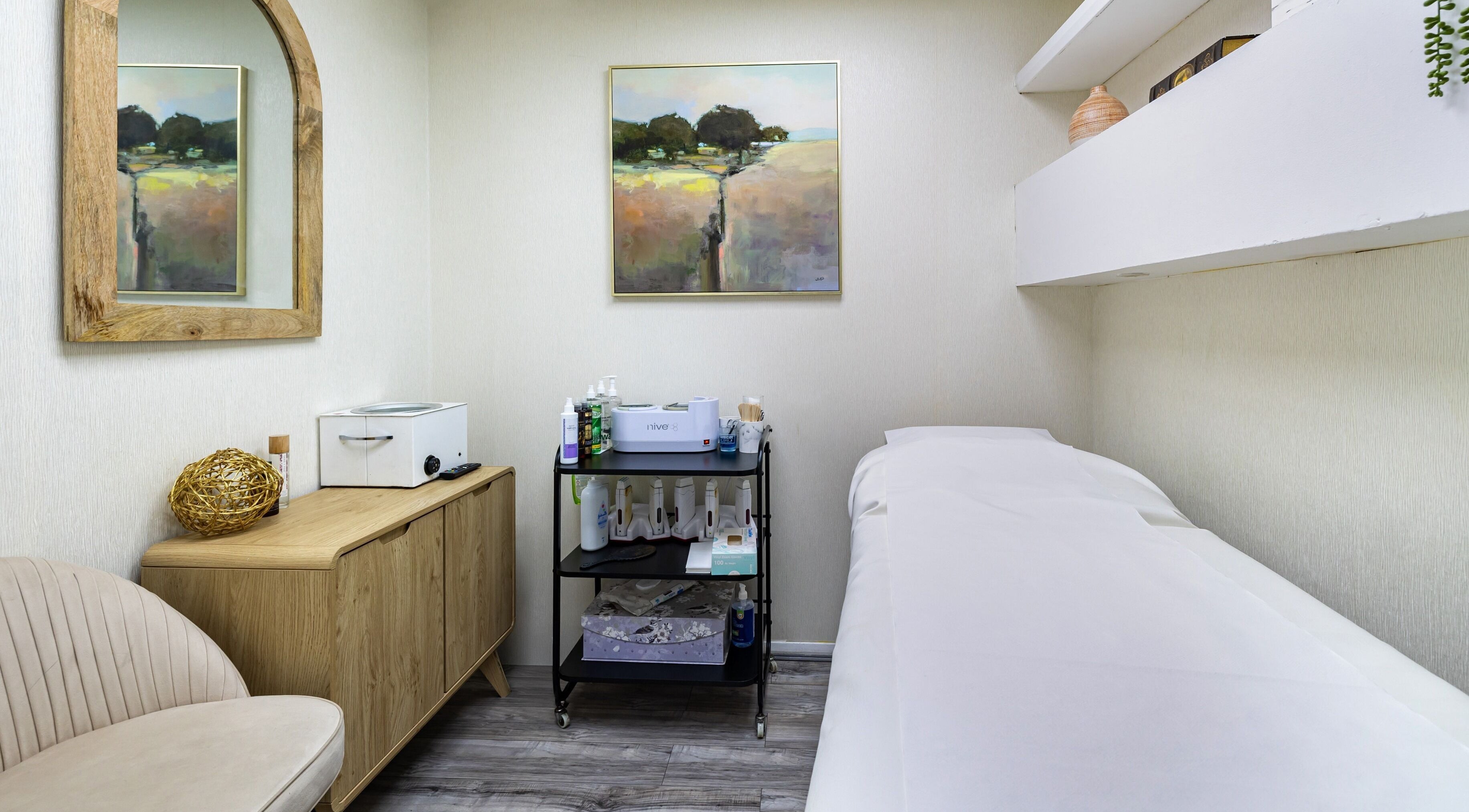 Luxury Wax Bar - Edgware Road offers a serene treatment room in London, England, GB with stylish decor.