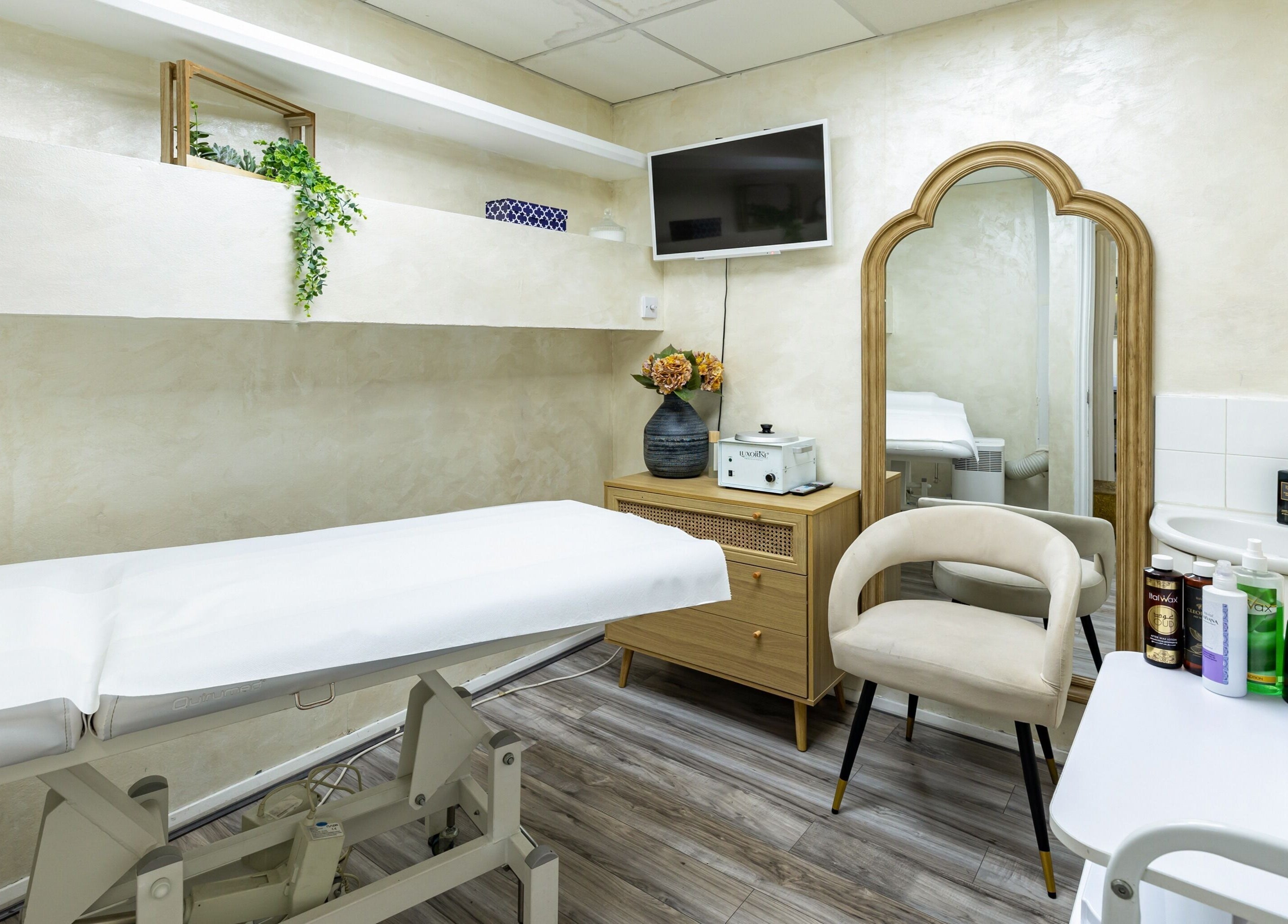 Spa room at Luxury Wax Bar - Edgware Road, London, England, GB, featuring a treatment bed and elegant decor.