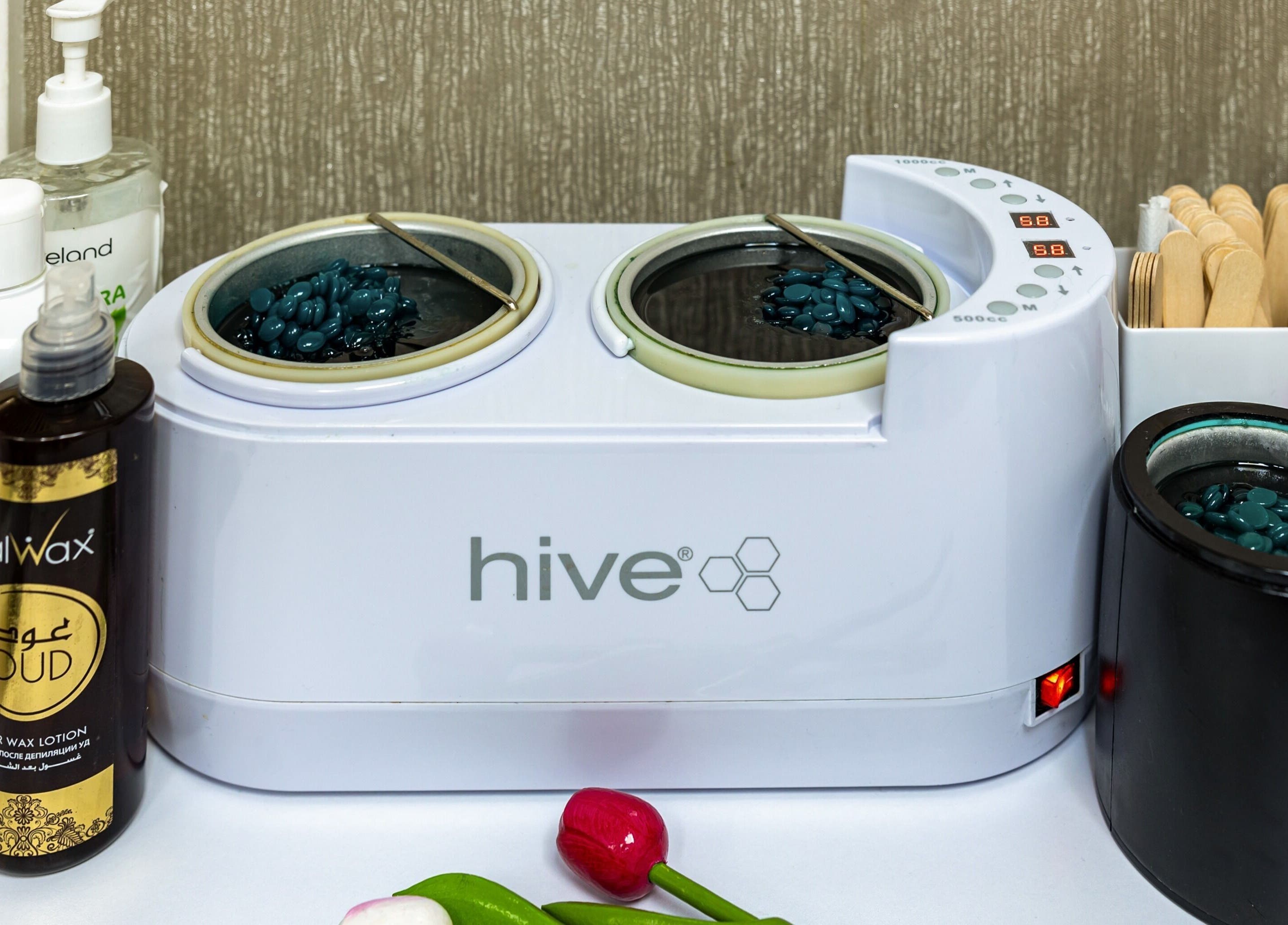 Waxing setup at Luxury Wax Bar - Edgware Road, London, England, GB featuring wax, applicators, and lotions.