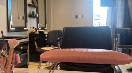 Sleek salon interior at Sage Blair Beauty, San Fernando, TT, showcasing elegant chairs and beauty tools.