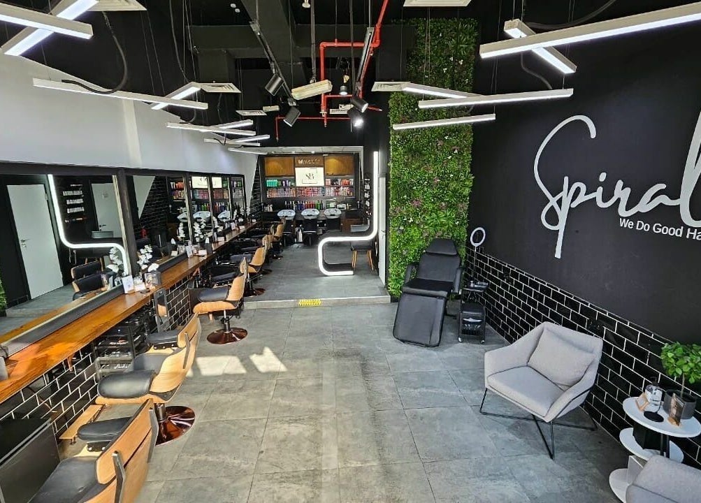 Modern interior of Spirals Salon in Dubai, AE featuring styling stations and chic decor.