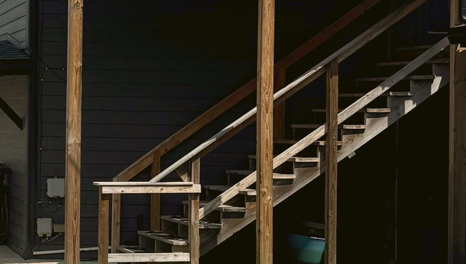 Outdoor wooden staircase at Audreys Afterglow Esthetics and Permanent Cosmetics, Jackson, Ohio, US.