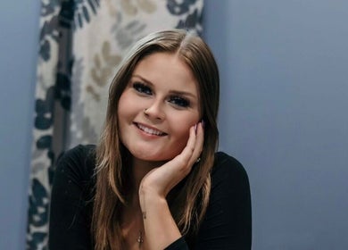 Smiling woman at Audreys Afterglow Esthetics and Permanent Cosmetics, Jackson, Ohio, US, exemplifying beauty and grace.